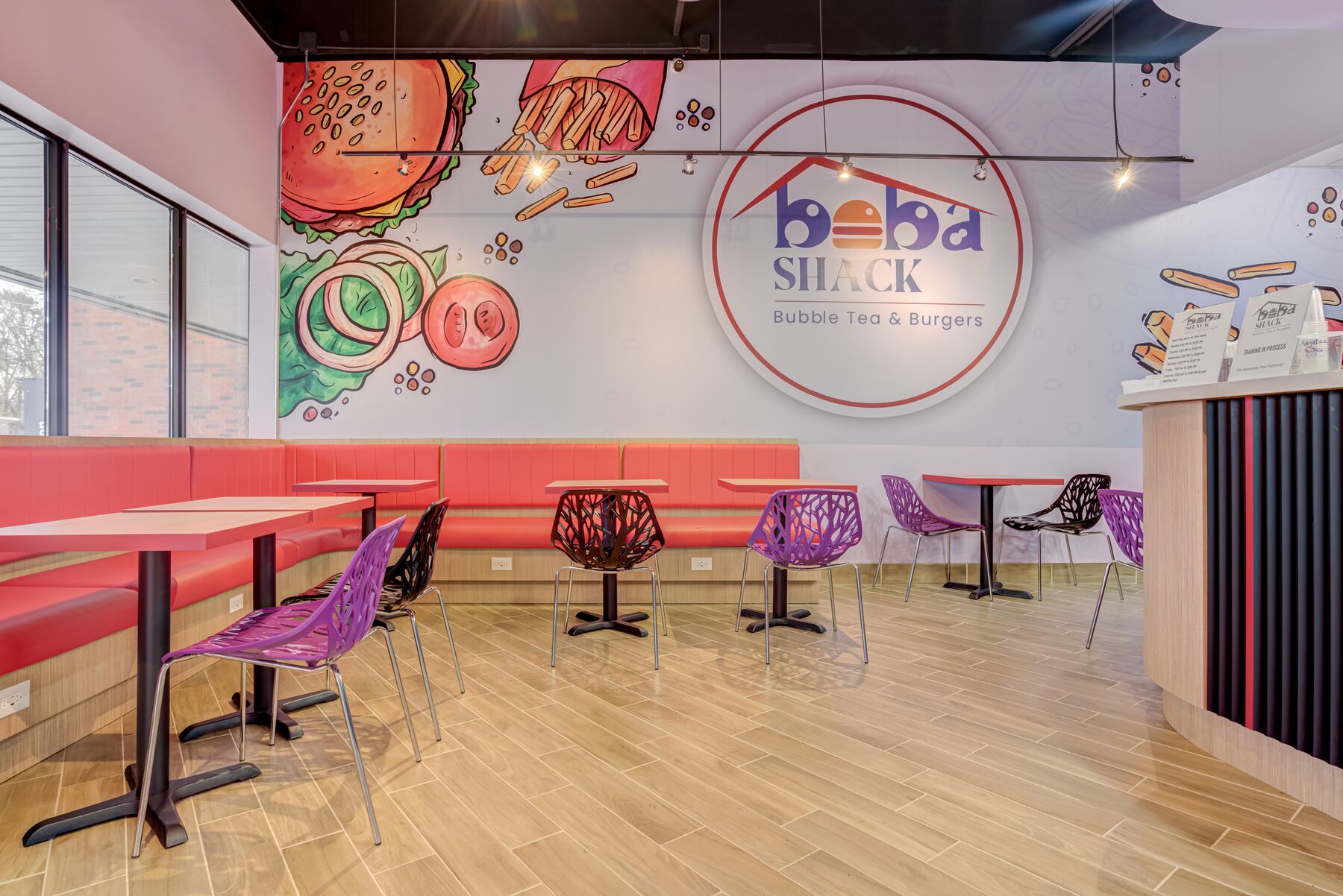Restaurant dining area with custom graphics and banquette seating