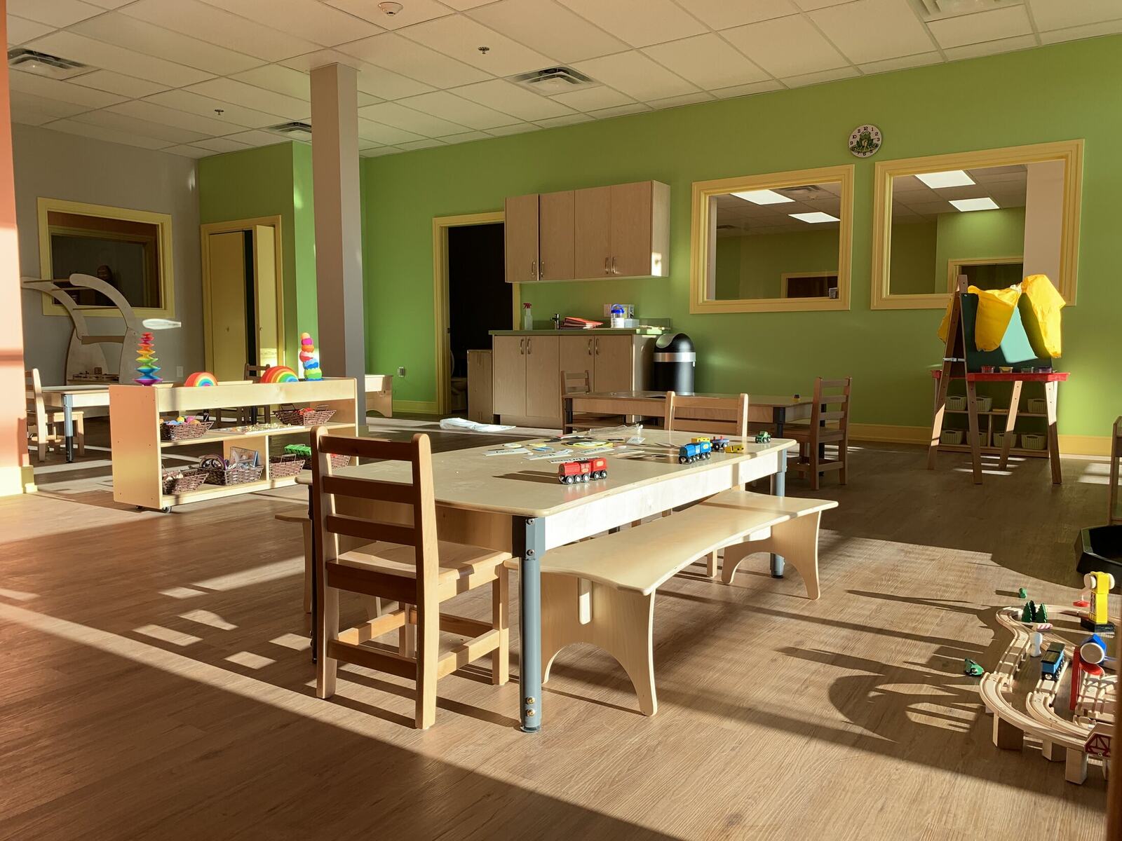 Daycare classroom with child-scaled millwork tables and activity areas