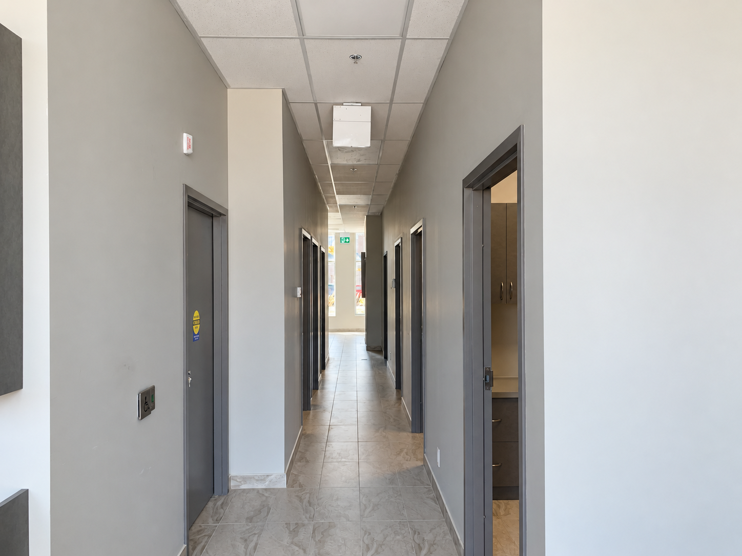 Clinic corridor connecting the reception and interior rooms.